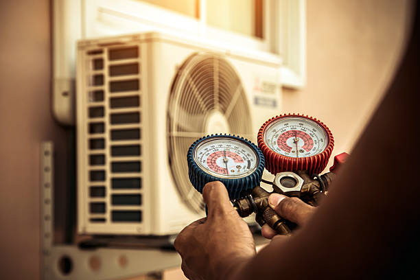 Professional Heat Pump Repair technician working in Mendon, MA